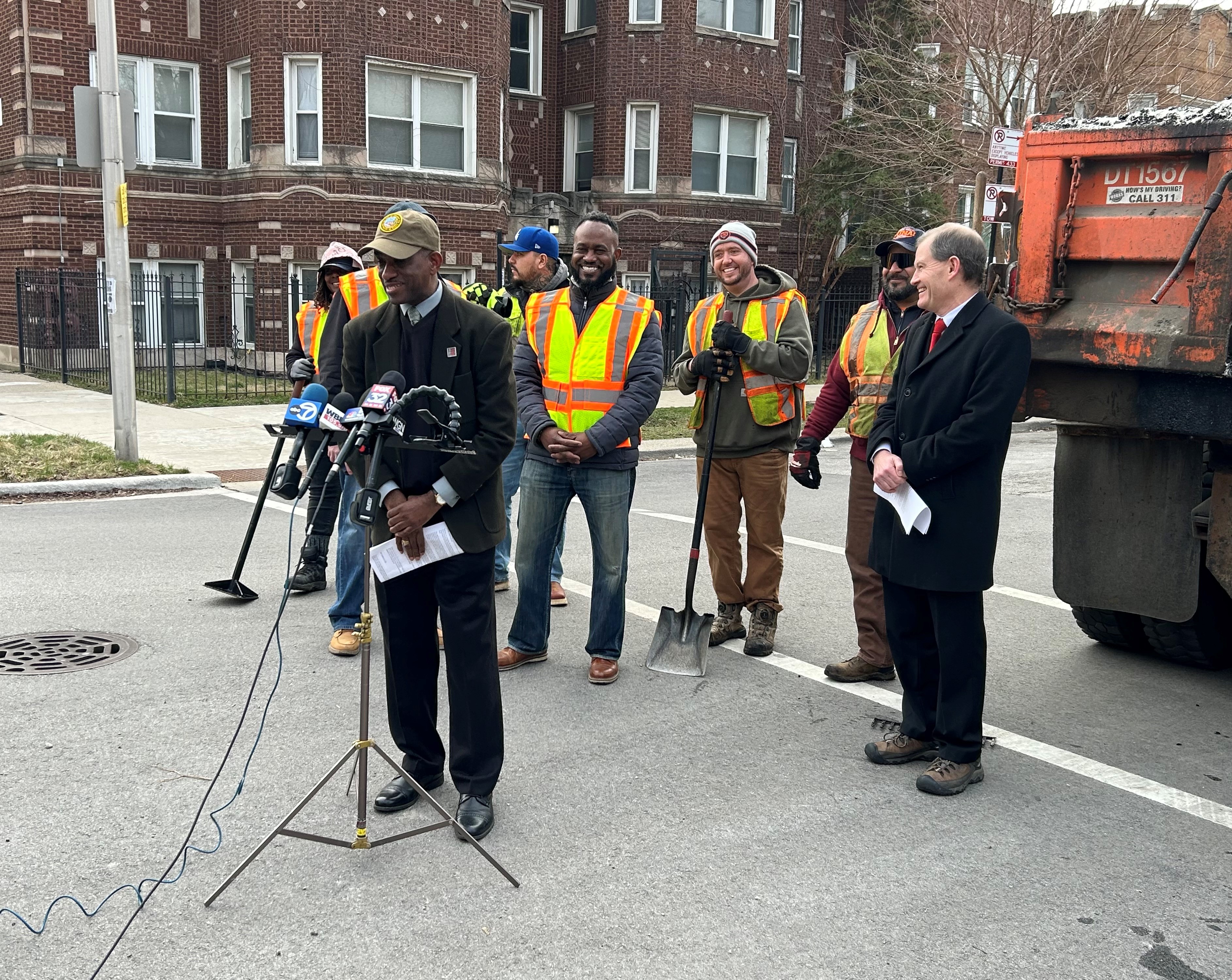 Alderman David Moore Speaks in Front of a group of CDOT pothole crews in the 17th Ward